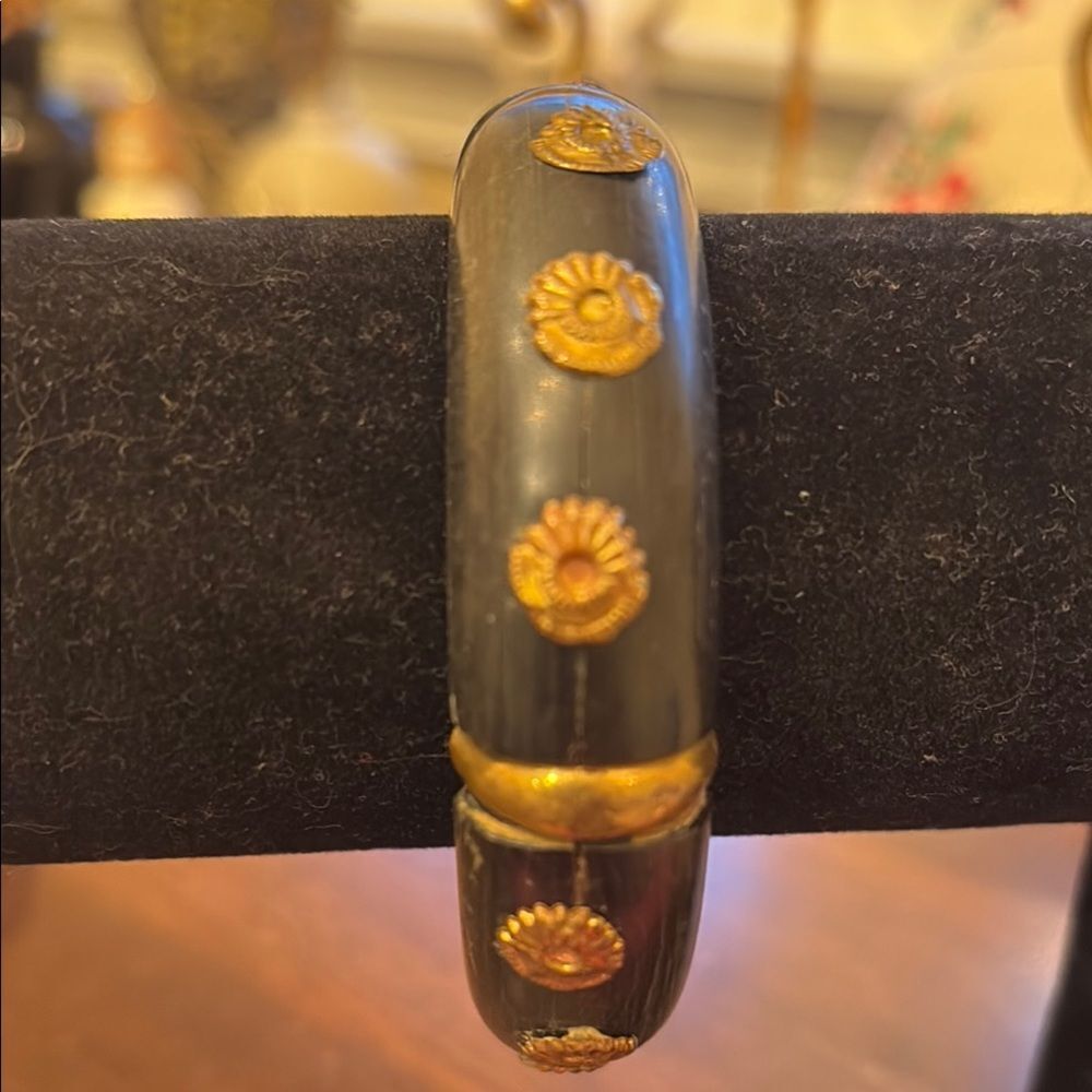 Black and Gold Bracelet with Unique Embedded Flowers